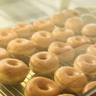 glazed donuts on a cooling rack