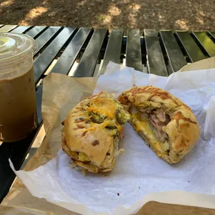 Bacon, hash brown, egg and cheese on a jalapeno bagel with a vietnamese coffee