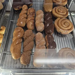 Display case of twists, bars, and cinnamon rolls