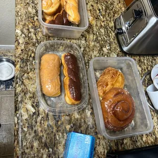 a variety of pastries in plastic containers
