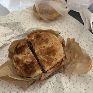 Turkey club on onion bagel. Glazed donut.