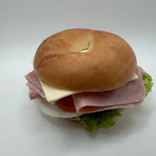 ham bagel sandwich - lettuce, tomato, onion, mayo, mustard &amp; swiss cheese