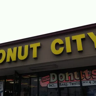 a donut shop with a donut sign