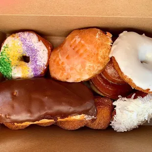 White Iced Cake Coconut Cake Cream filled Long John  Cinnamon Twist  Jelly Filled  Honeybun Mardi Gras