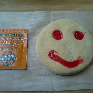 a smiley face and a packet of sprinkles