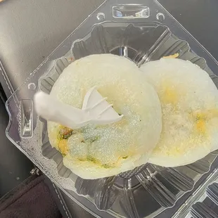 two donuts in a plastic container