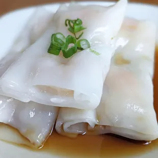 Cheung Fun mainly thick rice paper with minimal shrimp cut in half.