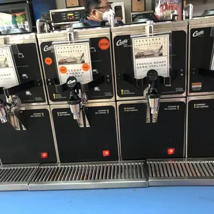 a row of donuts on a machine