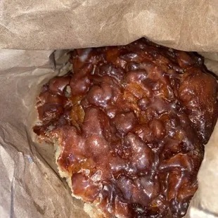 a piece of food wrapped in brown paper