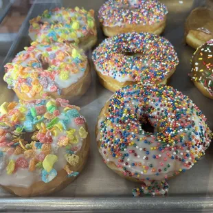 a variety of donuts with sprinkles