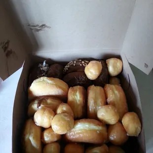 Dozen with donut holes as my 2 free! Buy a dozen and you get 2 free on Sundays.