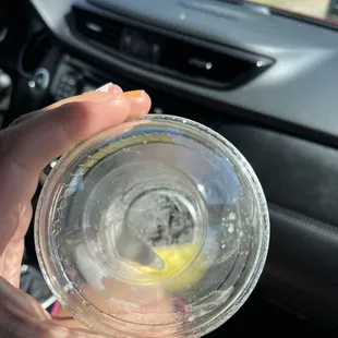 a person holding a glass of water