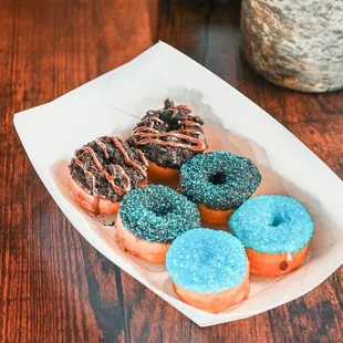 a tray of donuts on a table