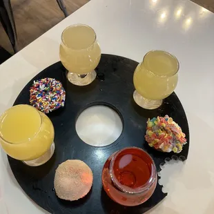 Mimosa flight (pineapple, grapefruit, orange, &amp; cranberry) w/ 3 pack donuts (fruity pebbles, homer, ?)