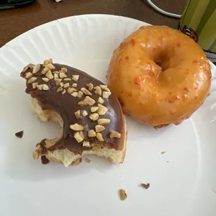 Chocolate with nuts and orange glazed cake donut
