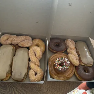 two boxes of doughnuts on a table