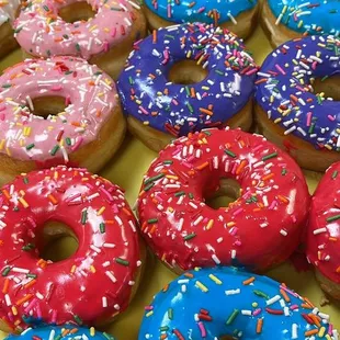 a variety of donuts with sprinkles