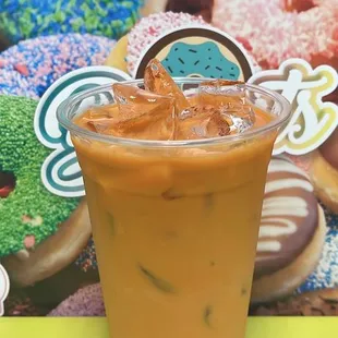 a cup of iced coffee on a table