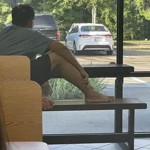 a man sitting on a bench