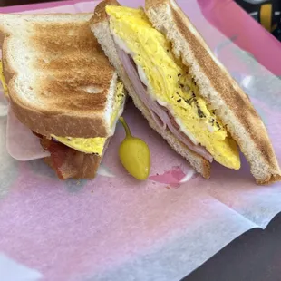 #12 Bacon, egg, ham, &amp; cheese sandwich on toast