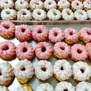 pink and white donuts with sprinkles