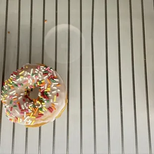 three different types of donuts on a cooling rack