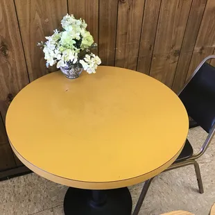 a table with a vase of flowers on it