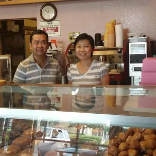 a man and a woman behind the counter