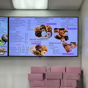 a woman sitting in front of a menu