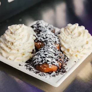Ore Uh Oh! - Crushed Gluten free Oreo® cookies, Ghirardelli® Chocolate Sauce, homemade vanilla whipped cream.