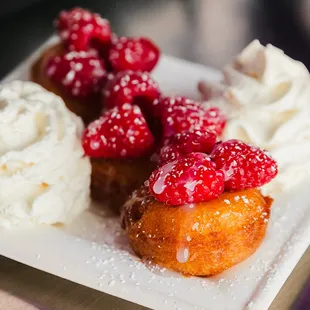 White Chocolate Raspberry - Fresh sliced raspberries, white chocolate icing, freshly made vanilla whipped cream, powdered cane sugar.