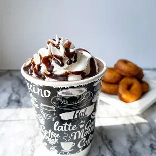 Perfectly crafted Ghirardelli hot chocolate topped with house made vanilla whipped cream and chocolate sauce drizzle.