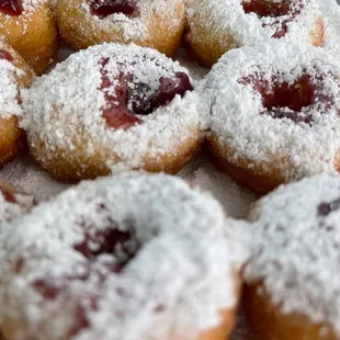 Mixed-berry Jelly Filled donuts topped with powdered sugar!