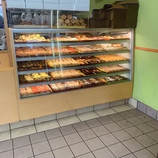a display case of donuts in a bakery