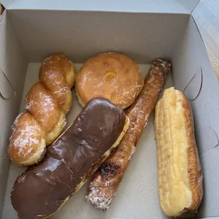 Glazed twist, maple custard filled bar, chocolate custard bar, lemon filled donut, and fruit bar.