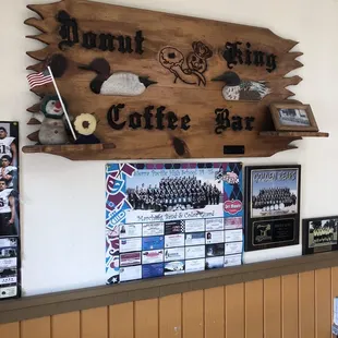 a coffee bar with a sign above it