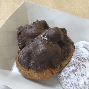 Chocolate covered buttermilk and raspberry filled donut