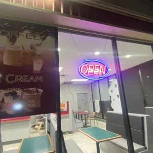 a neon sign in the window