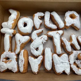 Customized donuts that are suppose to say &quot;30, Flirty and Thriving&quot;
