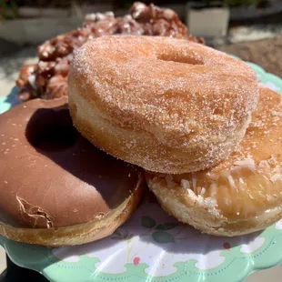 Chocolate, sugar, and glazed donuts