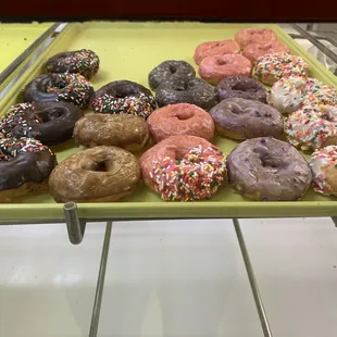 a tray of assorted donuts