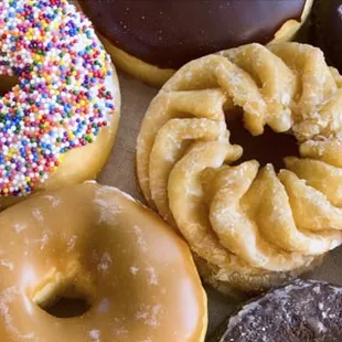 a variety of doughnuts with sprinkles