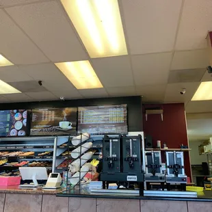 a counter with a variety of donuts