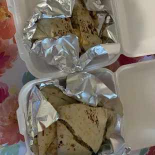 two trays of food on a table