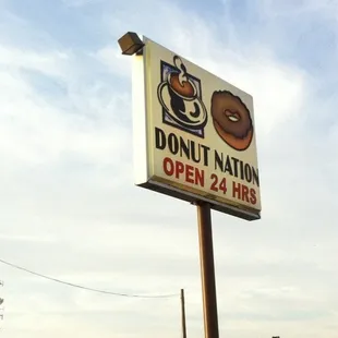 a donut nation sign on a pole