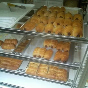 a display case filled with pastries