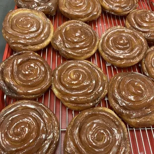 chocolate frosted donuts on a cooling rack
