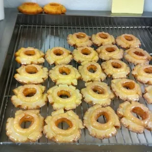 a tray of glazed donuts on a grill