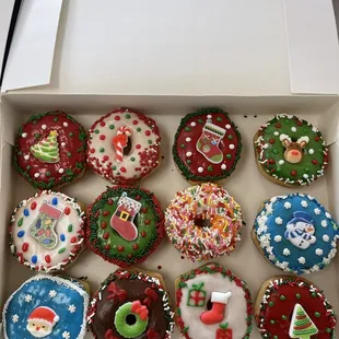 a box of twelve decorated cupcakes