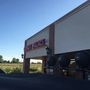 the outside of a donut palace store